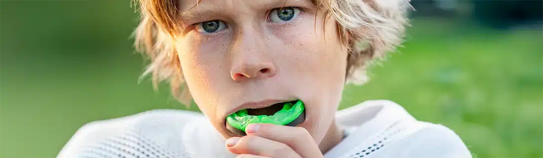 Dentist Boy Putting In His Mouth Guard CS1