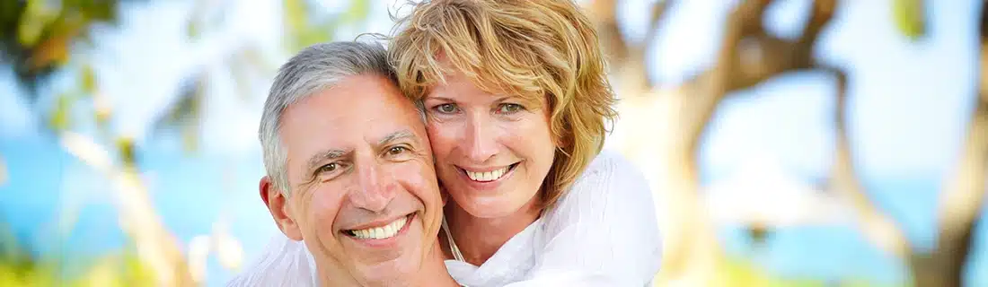 Dentist Senior Couple At Beach Smiling CS1